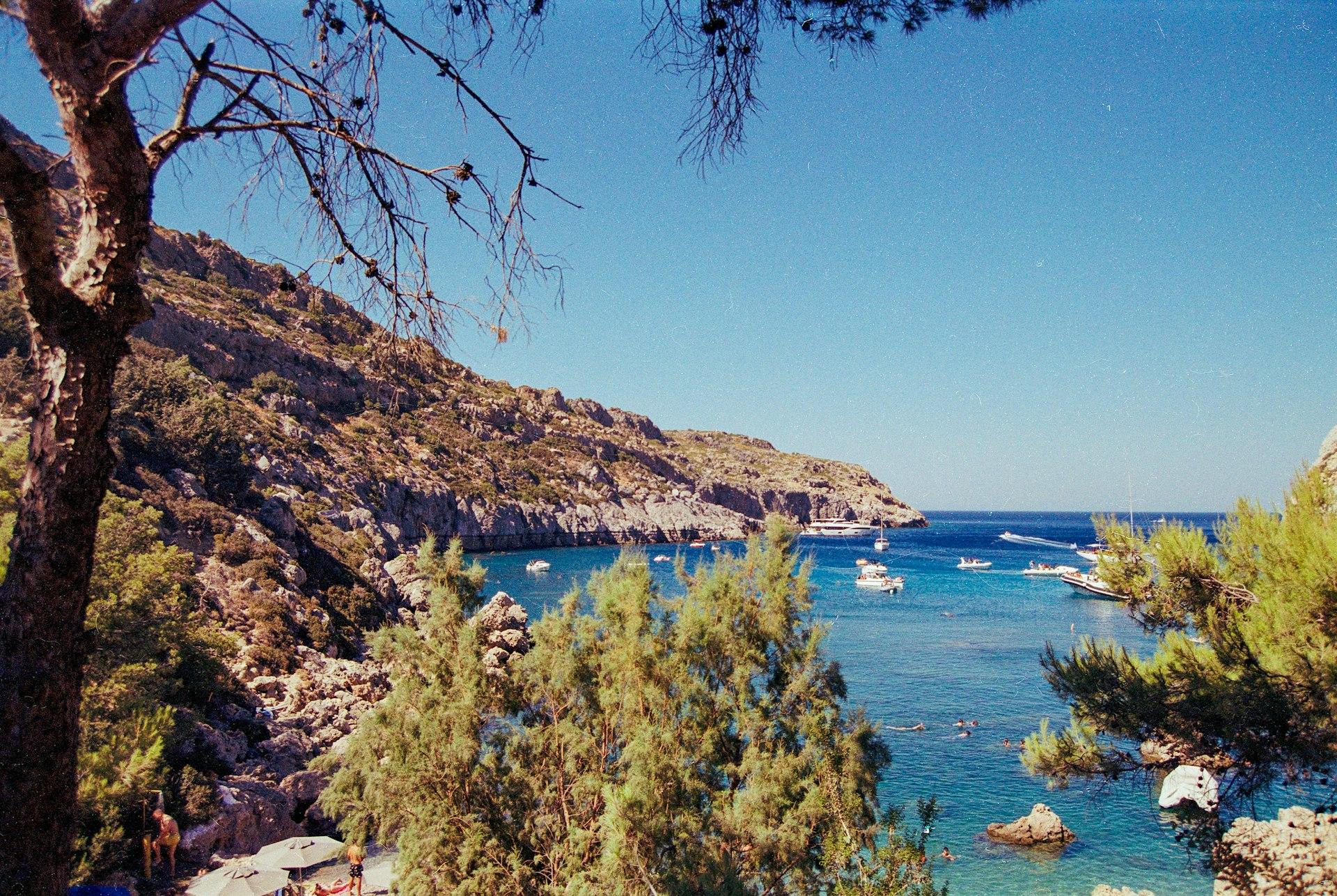 A body of water surrounded by trees and rocks